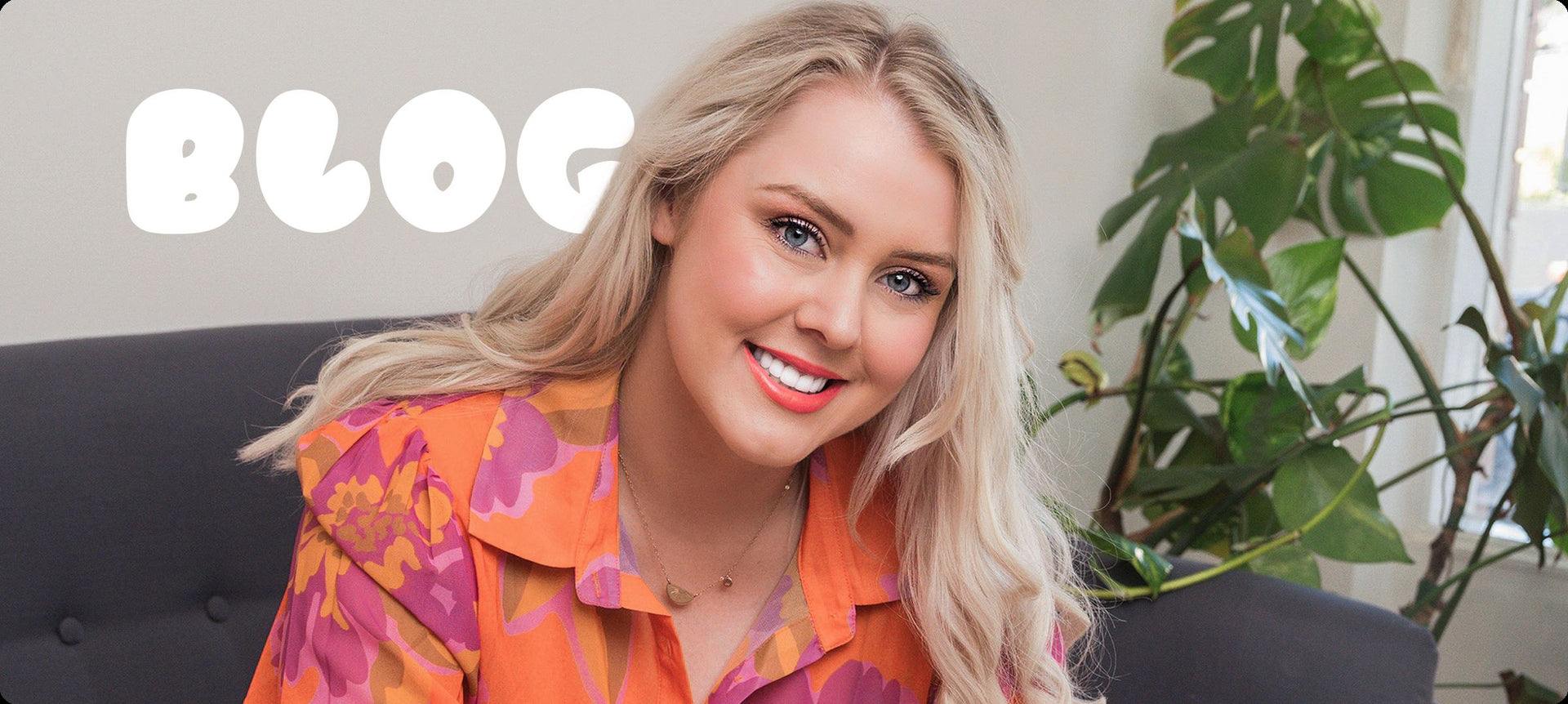 Flic from Your Fan Club smiling on a couch beside a plant, with ‘Blog’ text displayed in the background.